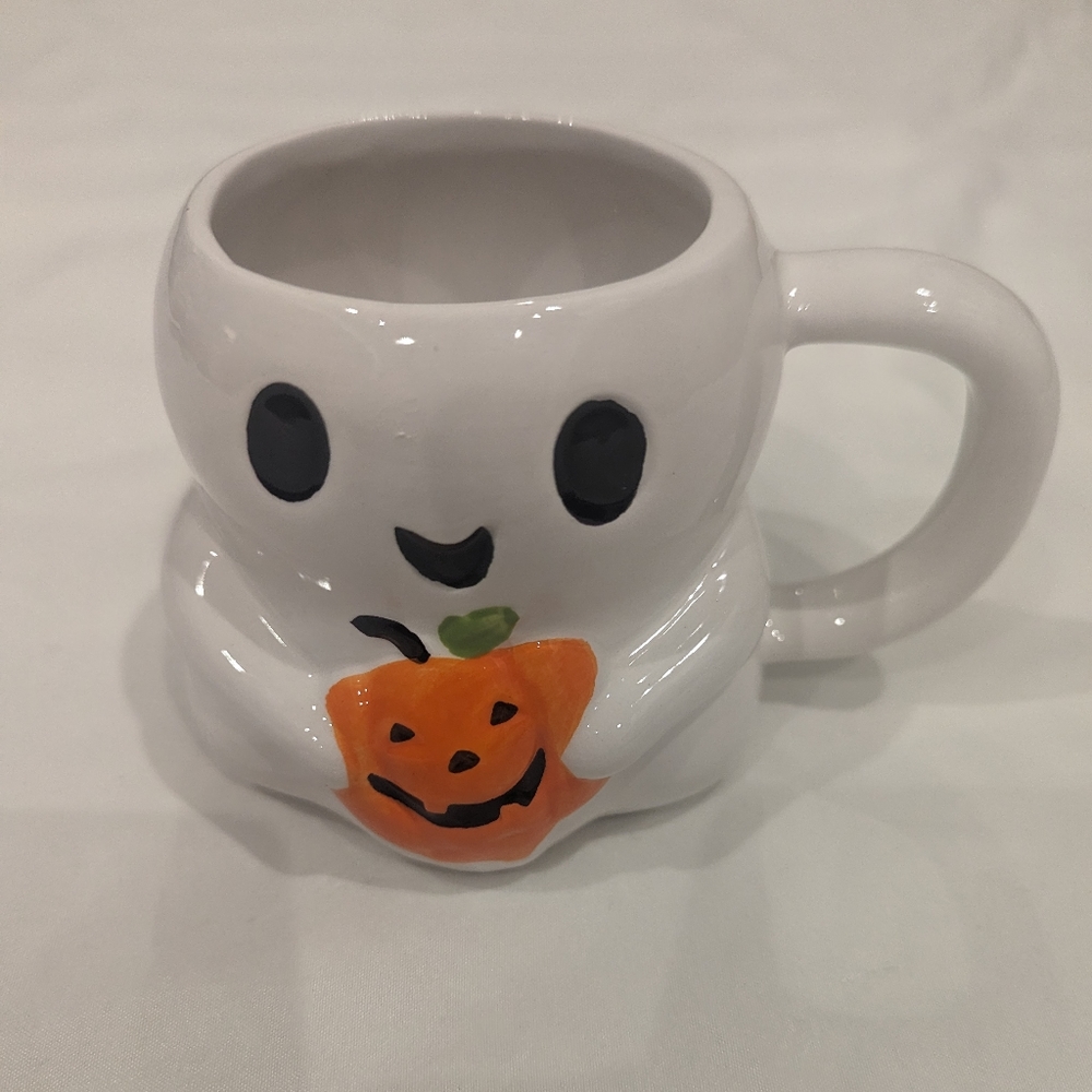 Ghost with jack-o'-lantern mug